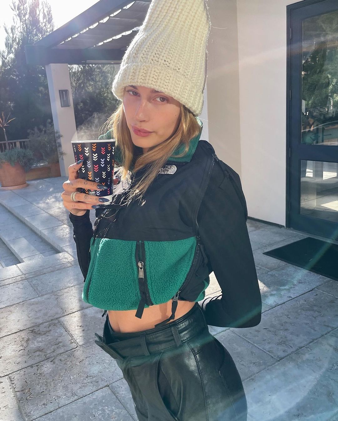 Hailey Bieber in a MM6 x The North Face jacket